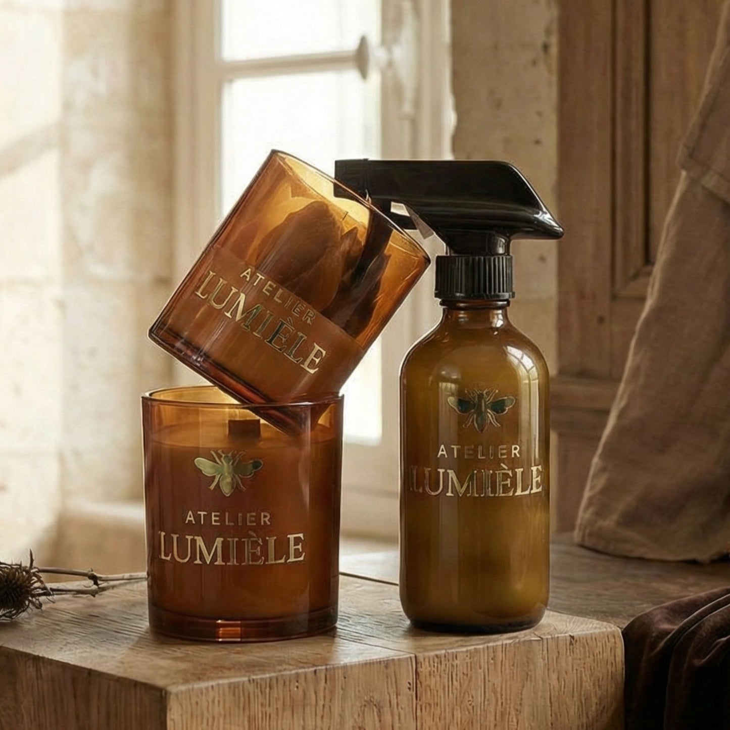 Detailed view of product contents inside amber glass gift set from Atelier Lumiele