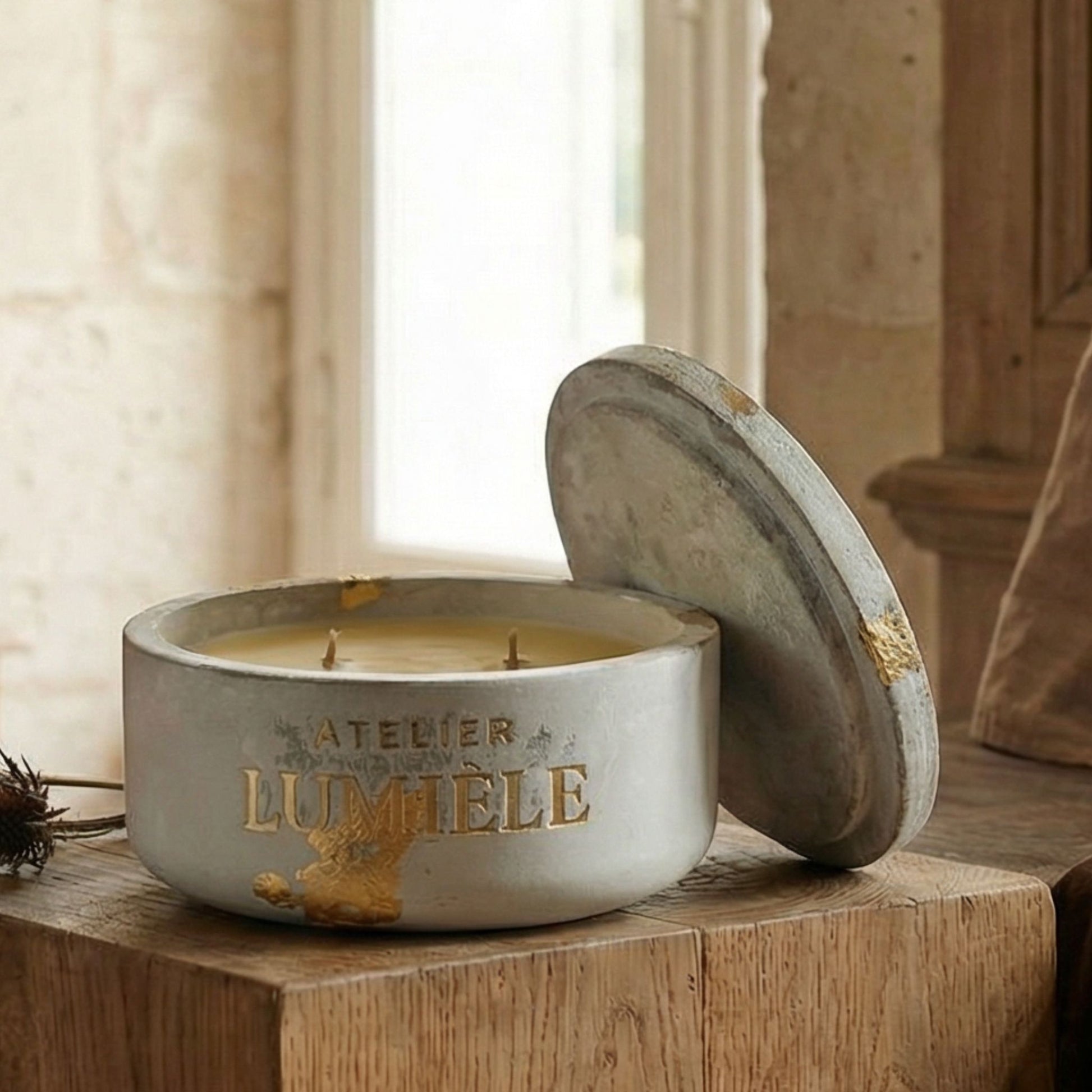 Close-up detail of cement candle jar surface with beeswax fill from Atelier Lumiele