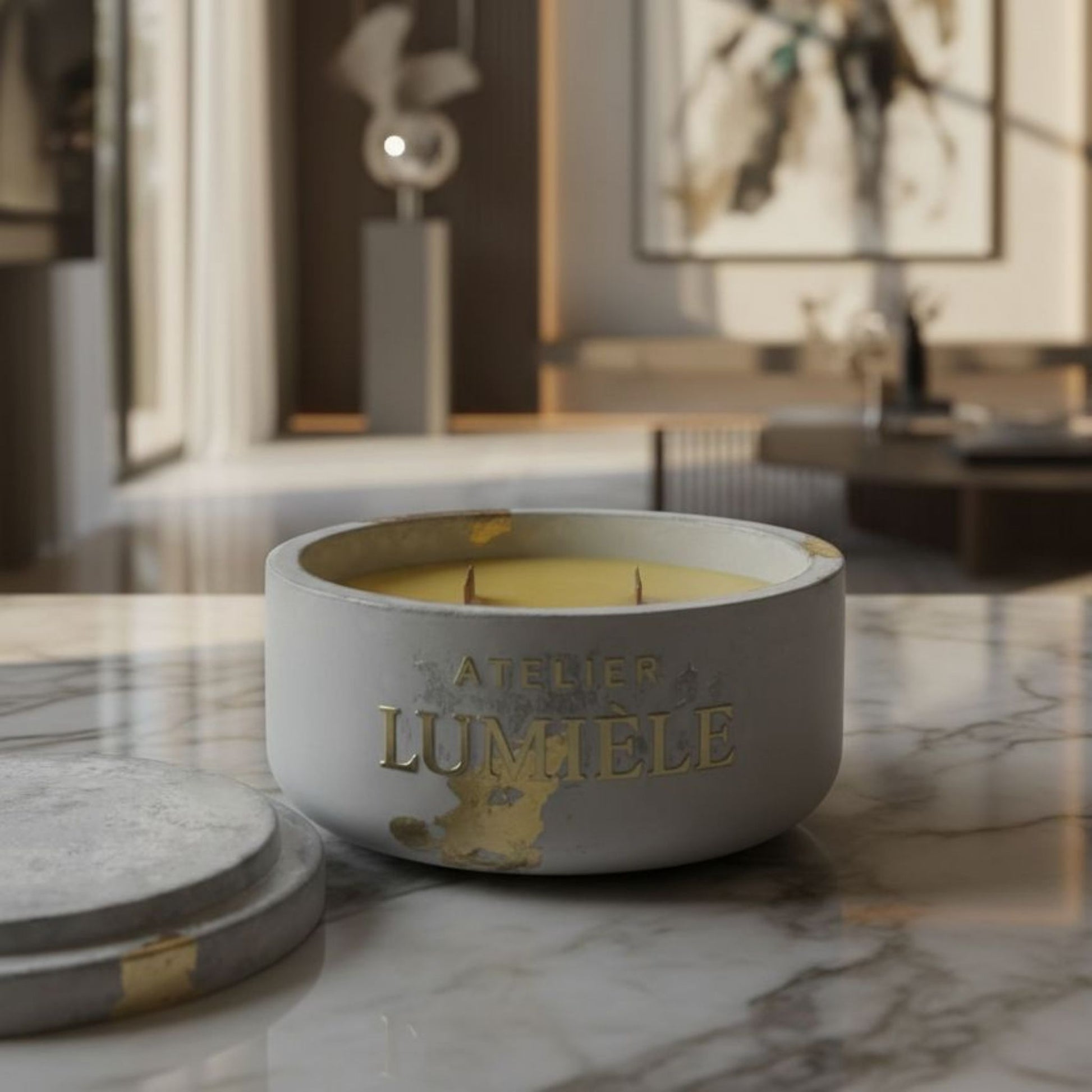 Interior décor arrangement featuring beeswax candle in cement jar from Atelier Lumiele