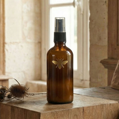 Close-up detail of mini interior perfume spray bottle from Atelier Lumiele