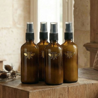 Close-up detail of mini interior perfume set of four bottles from Atelier Lumiele