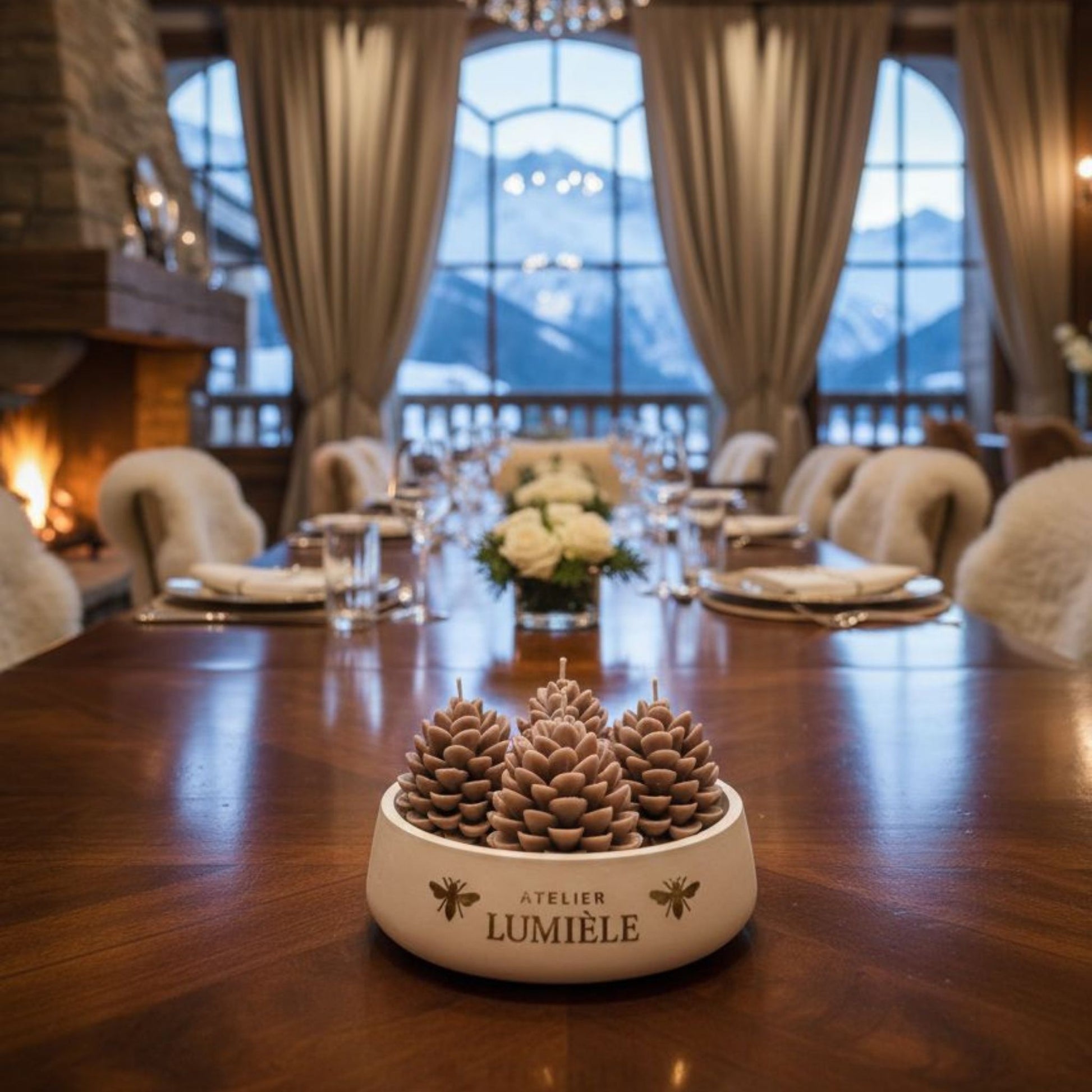 Decorated dining table featuring pine candle in large gypsum jar from Atelier Lumiele