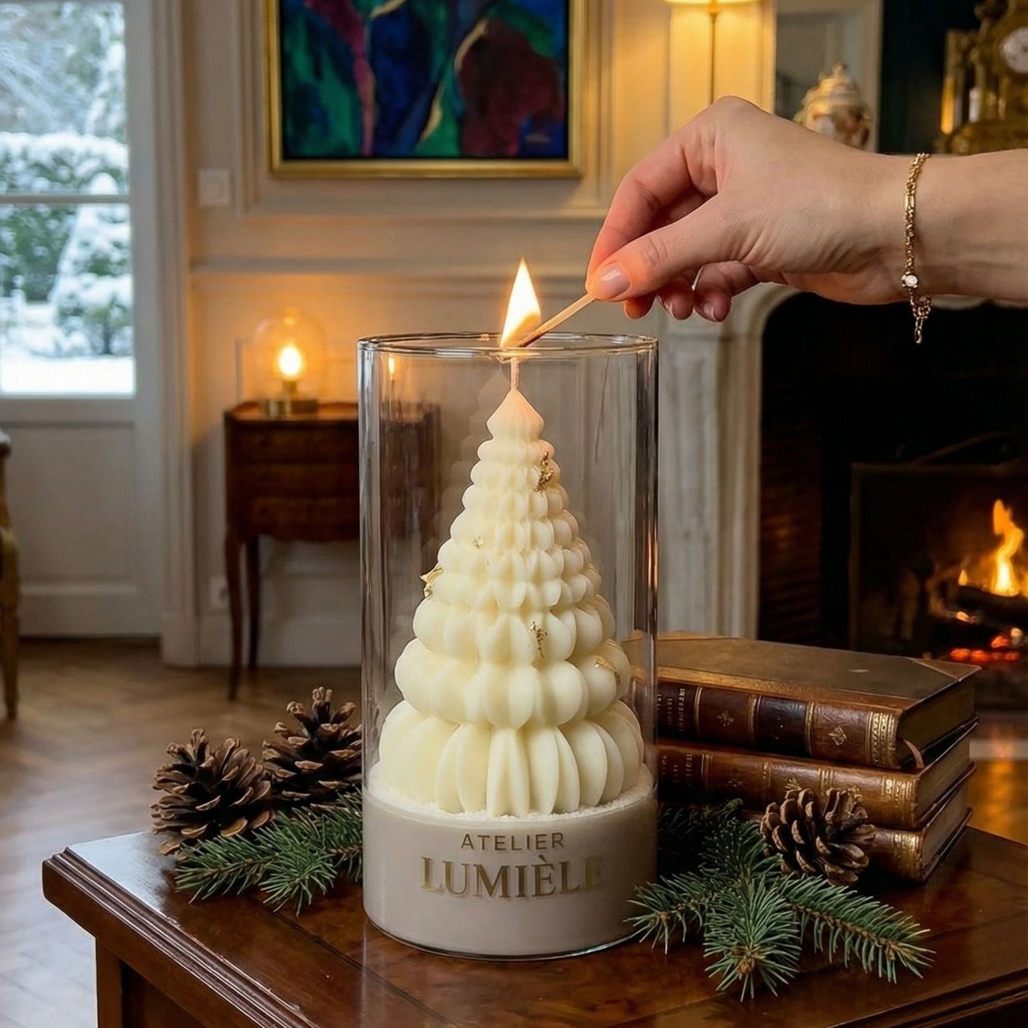 Moment of lighting the Christmas tree candle in glass vessel from Atelier Lumiele